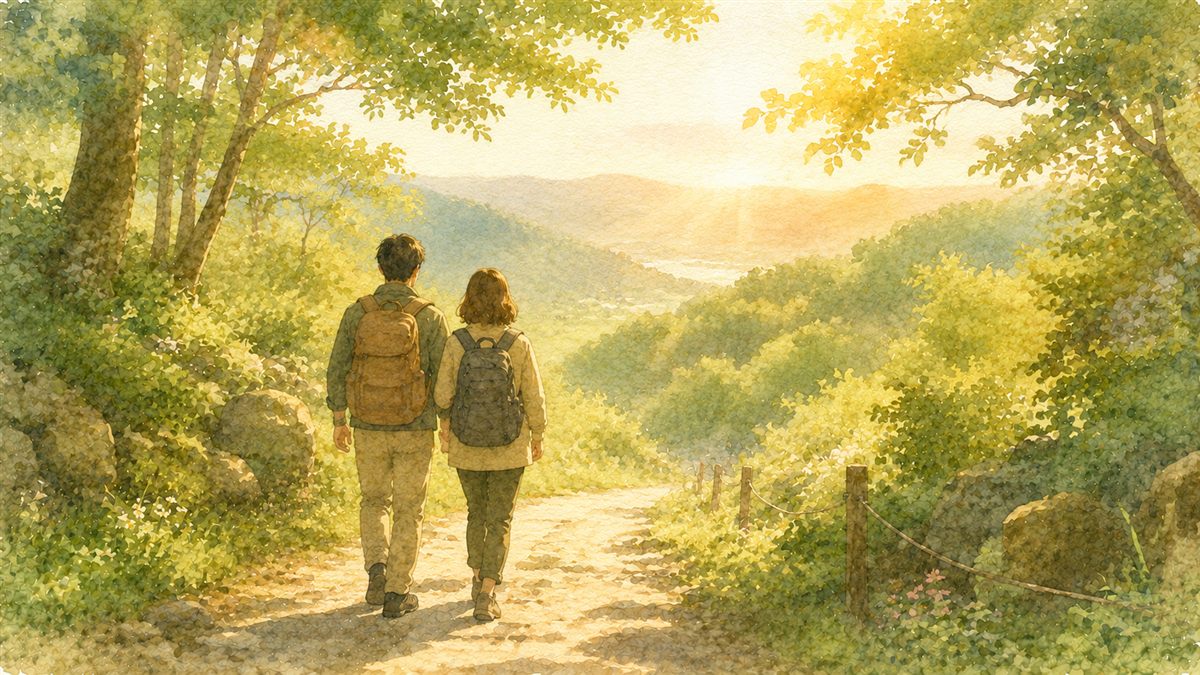 山道を並んで歩く二人の旅人の後ろ姿